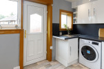 Kitchen featuring washer dryer 