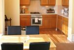 fully equipped kitchenette with dining table off lounge
