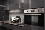 Open Plan Fully-equipped kitchen : Glassware, crockery, cutlery & utensils ,Cooker hob & hood ,Combi Oven Nespresso coffee machine , Electric kettle ,Refrigerator   