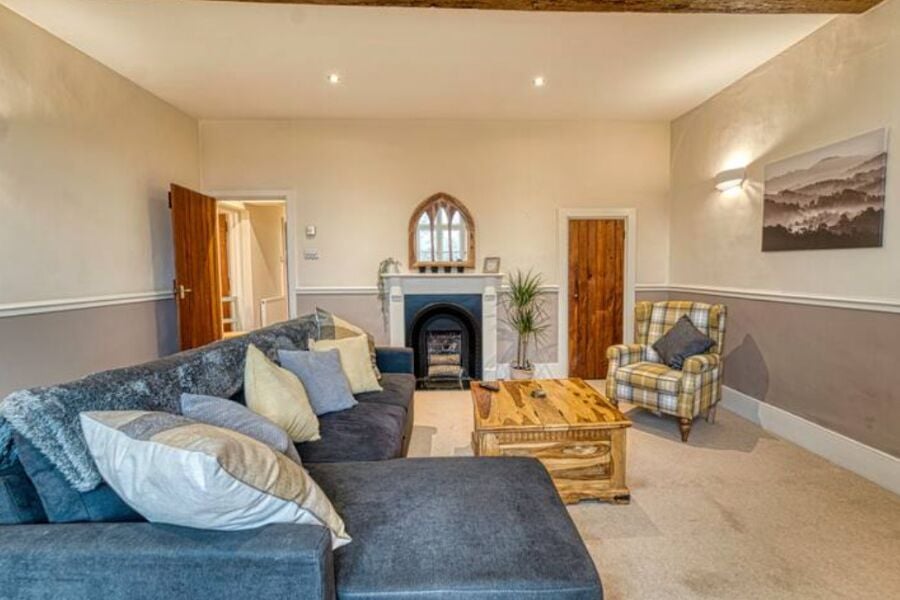 Spacious and cozy lounge with smart tv and beautiful garden view